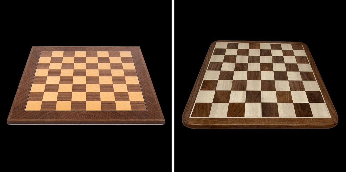 Inlaid walnut chessboard by Ferrer beside a Rex Noir solid timber acacia chessboard