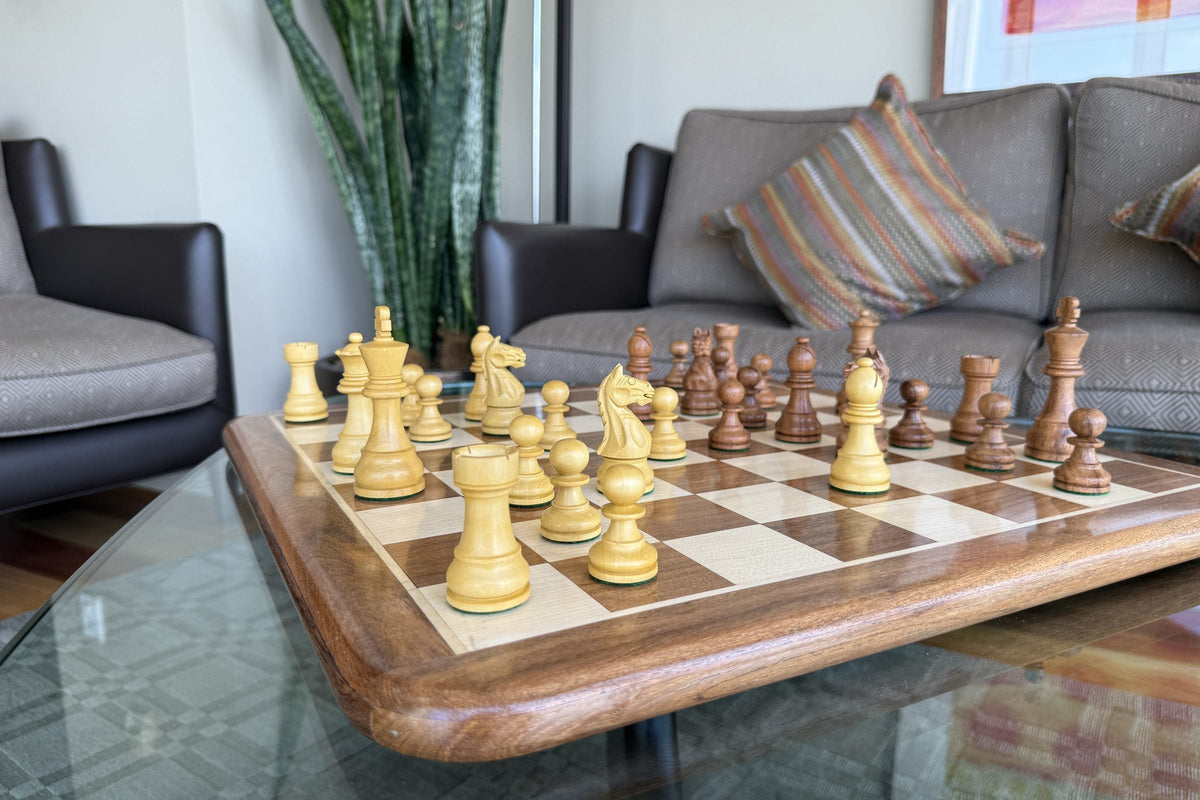 Rex Noir wooden chess set on a solid timber chessboard on a living room coffee table