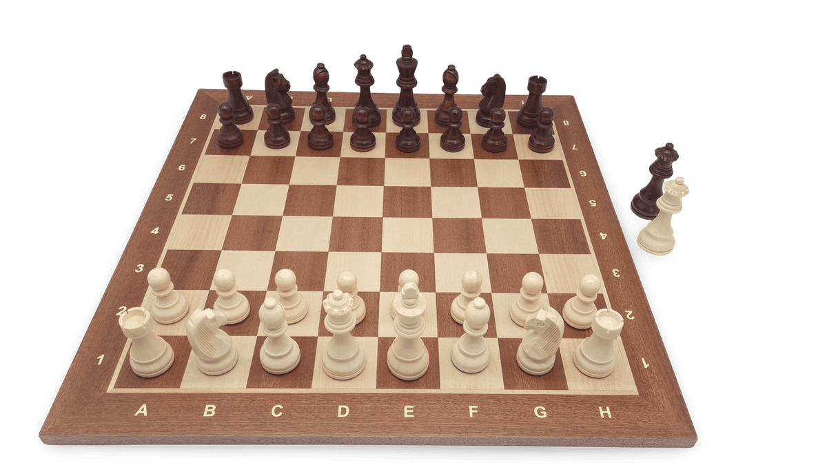 Wooden chess pieces displayed on board