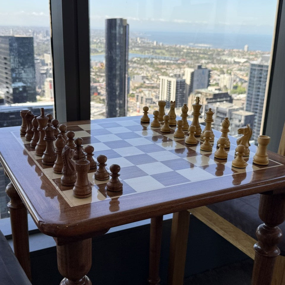 Lifestyle shot of Paris Classic Chess Pieces on Wooden Rex Noir Chess Table